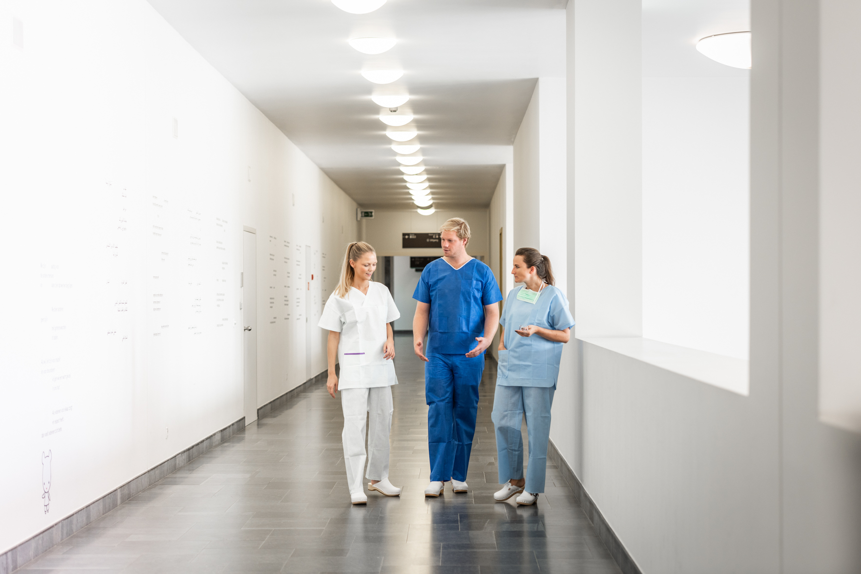 Clinicians in a hospital corridor